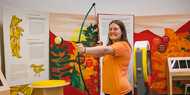 woman holding bow and arrow