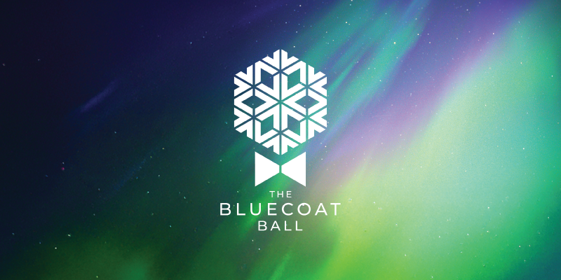 Bluecoat Ball logo featuring a stylized white snowflake above a blue lab coat icon, displayed over a colourful northern lights background in shades of green, blue, and purple.