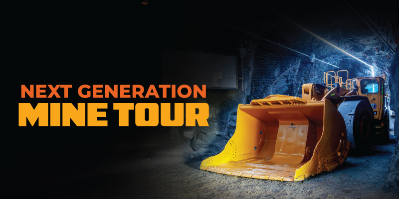 Promotional graphic showing a bright yellow underground mining loader parked inside a dimly lit tunnel with rock walls. Bold orange text reads “Next Generation Mine Tour.”