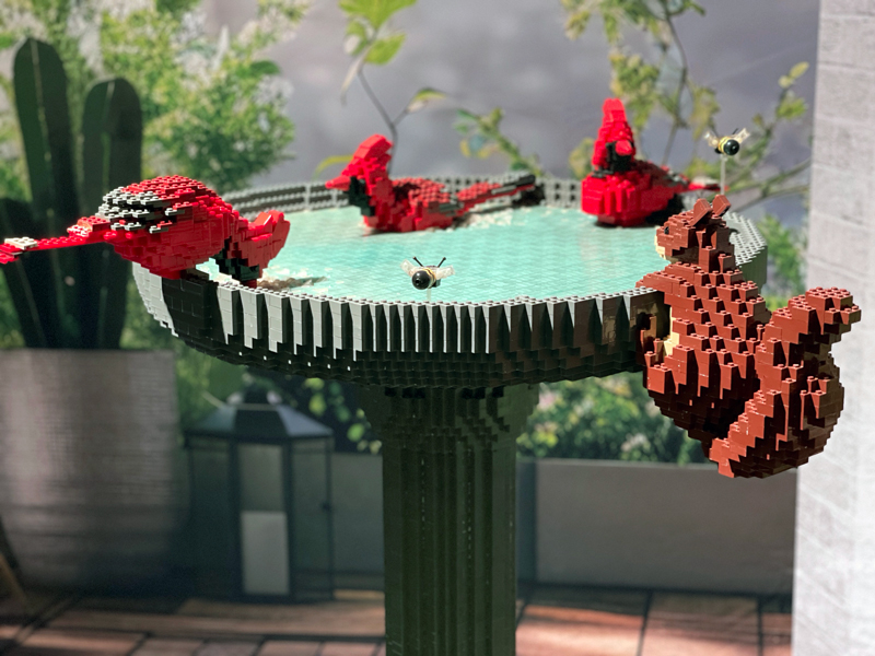 bird bath with cardinals and bumble bee made of lego bricks