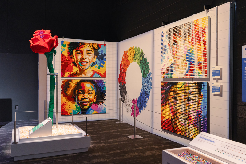 giant rose and face portraits made of lego bricks